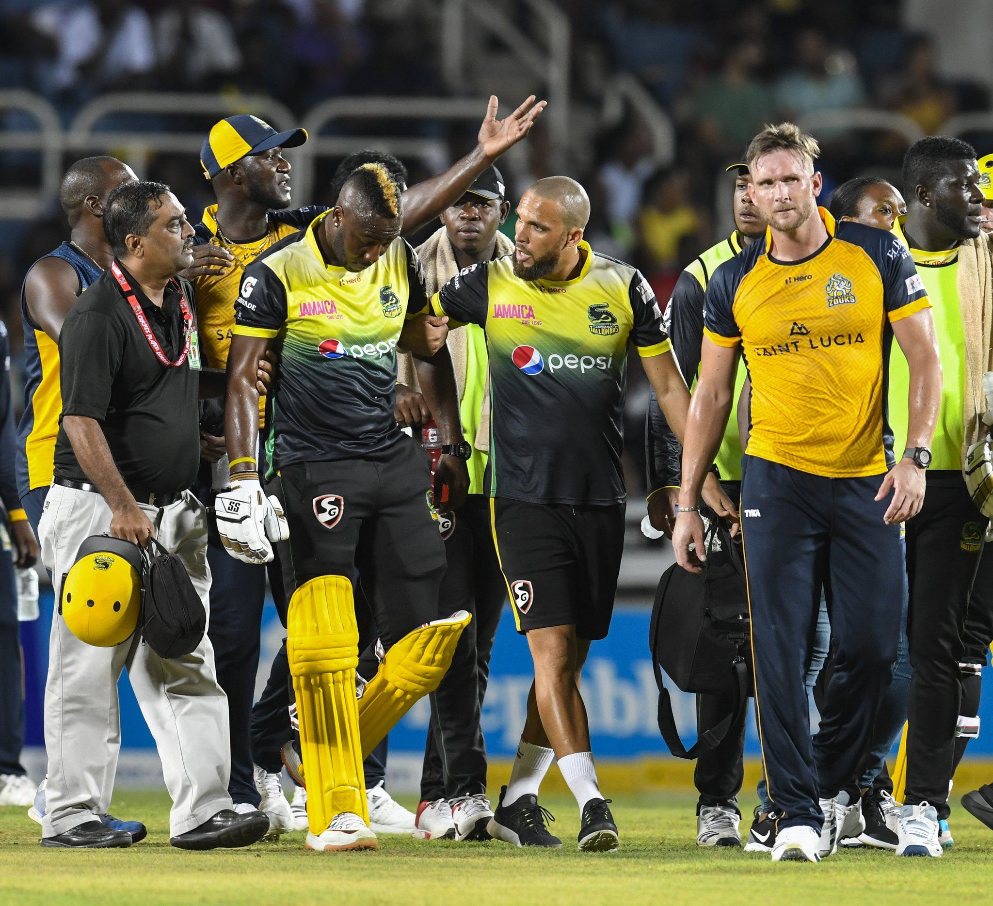 Andre Russell walked off the field after hit by a bouncer.
